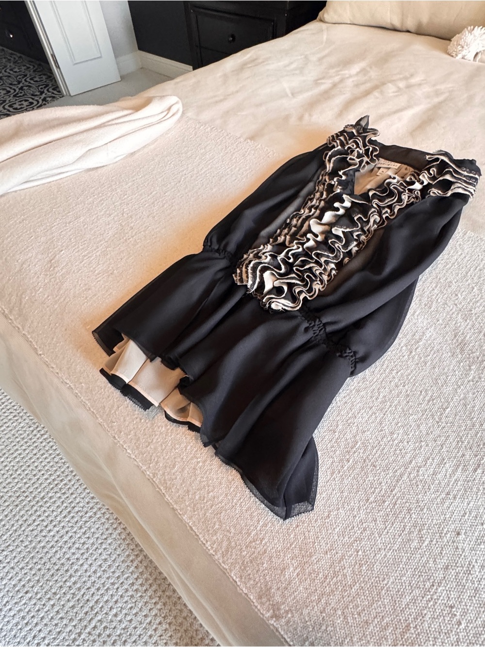 Elegant Black Blouse with Cream Ruffle Trim